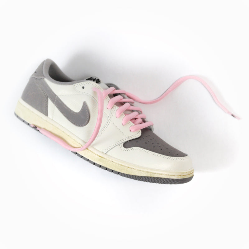 Looped Laces Cactus Pink thick oval shoelaces tied in a single Air Jordan 1 Low Atmosphere Grey sneaker