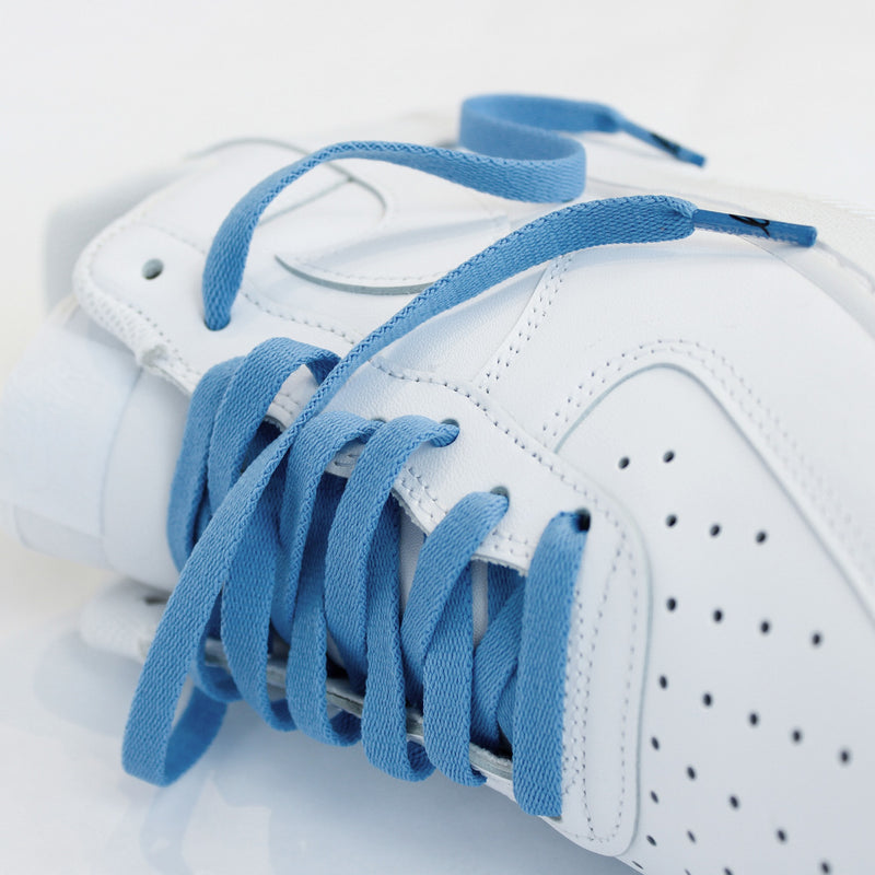 Looped Laces Cobalt Blue flat shoelaces in Nike Air Force 1 all white sneaker on white background with close up on laces