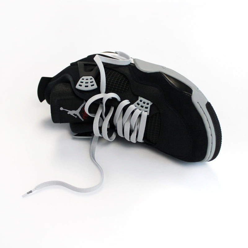 Looped Laces Light Grey flat shoelaces tied in Air Jordan 4 Black Canvas single sneaker on side