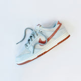 Looped Laces Light Grey thick rope shoelaces in Nike Dunk Fossil Rose sneaker on its side on white background