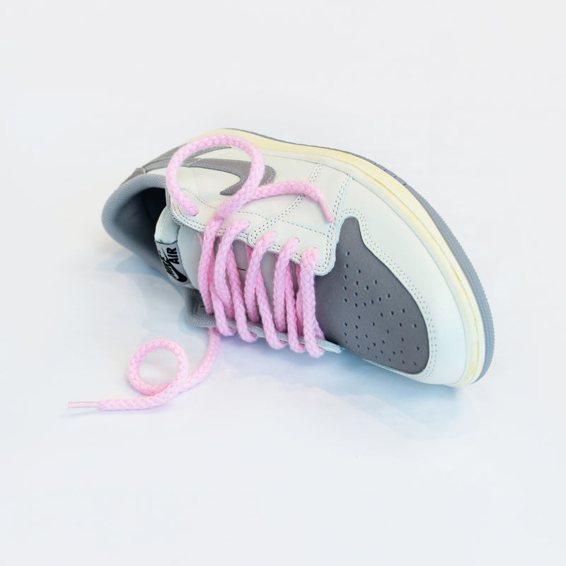 Looped Laces Light Pink Thick Rope shoelaces in Jordan 1 Low Atmosphere Grey sneaker on white background with close up on laces