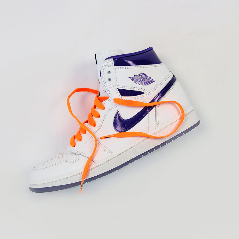 Looped Laces Orange Blaze flat shoelaces in Air Jordan 1 High Court Purple on white background