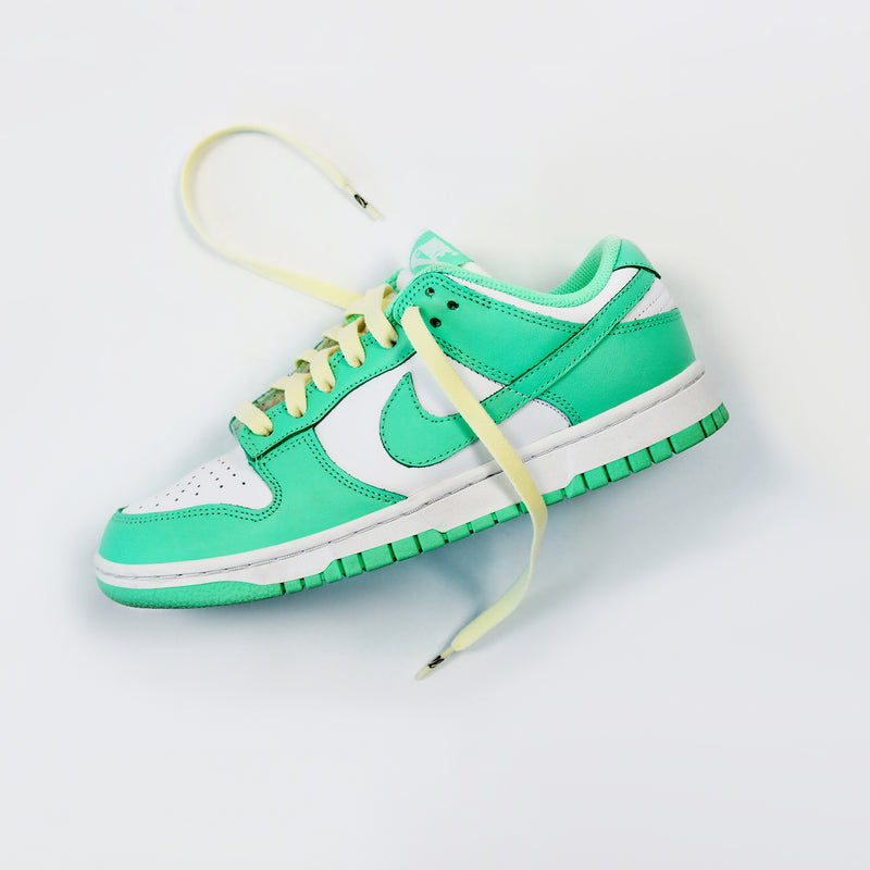 Looped Laces Pineapple Whip flat light yellow shoelaces in Nike Dunk Green Glow sneakers on white background