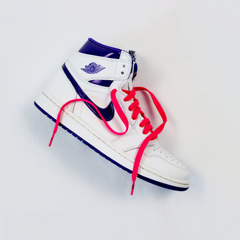 Looped Laces Racer Pink flat shoelaces in Air Jordan 1 High Court Purple sneaker on white background