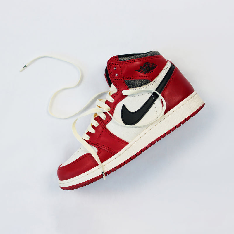 Looped Laces Vintage '85 light cream flat shoelaces in Air Jordan 1 Chicago Lost and Found sneaker on white background