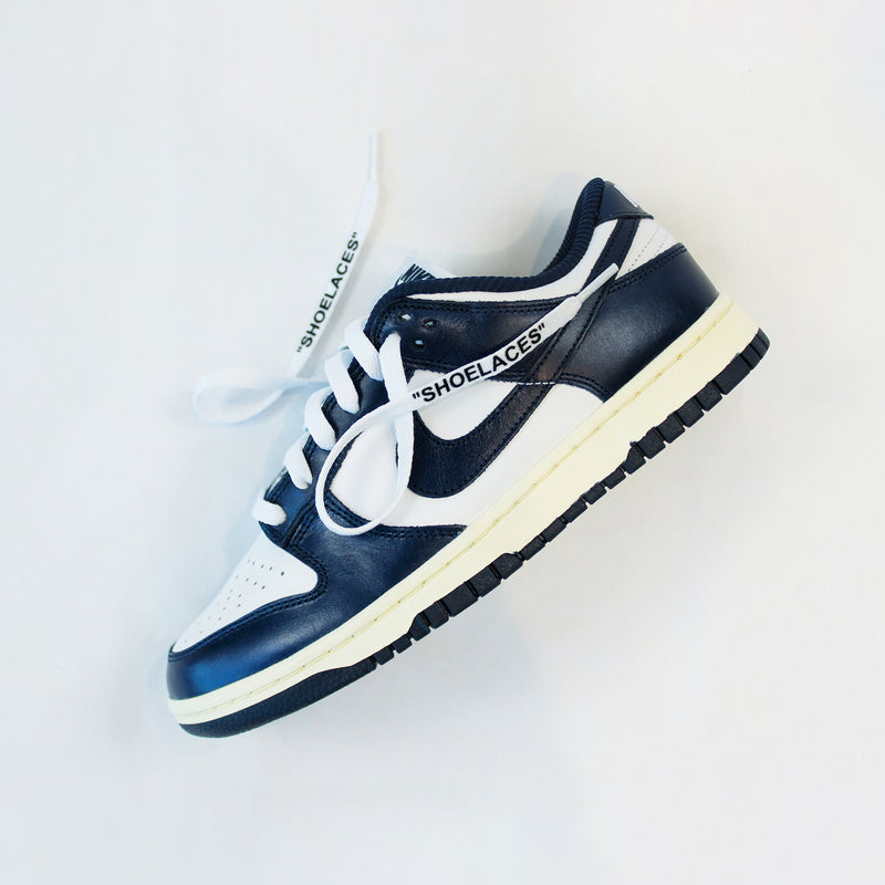 Looped Laces White off-white style shoelaces in quotes in Nike Dunk Vintage Navy sneaker on white background