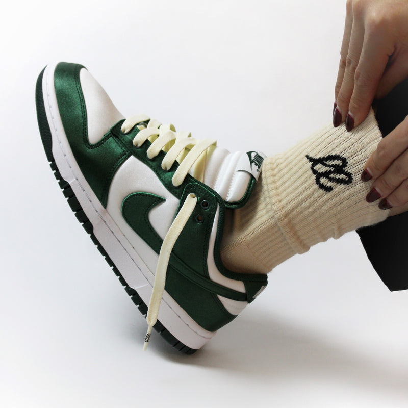 Looped Laces Vintage 85 cream shoelaces in Nike Dunk Satin Green sneaker with Comfort Cream crew socks being pulled up