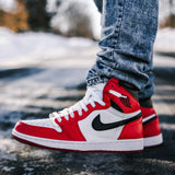 Looped Laces OG White flat shoelaces in Air Jordan 1 Chicago sneaker on foot with snowy backaground