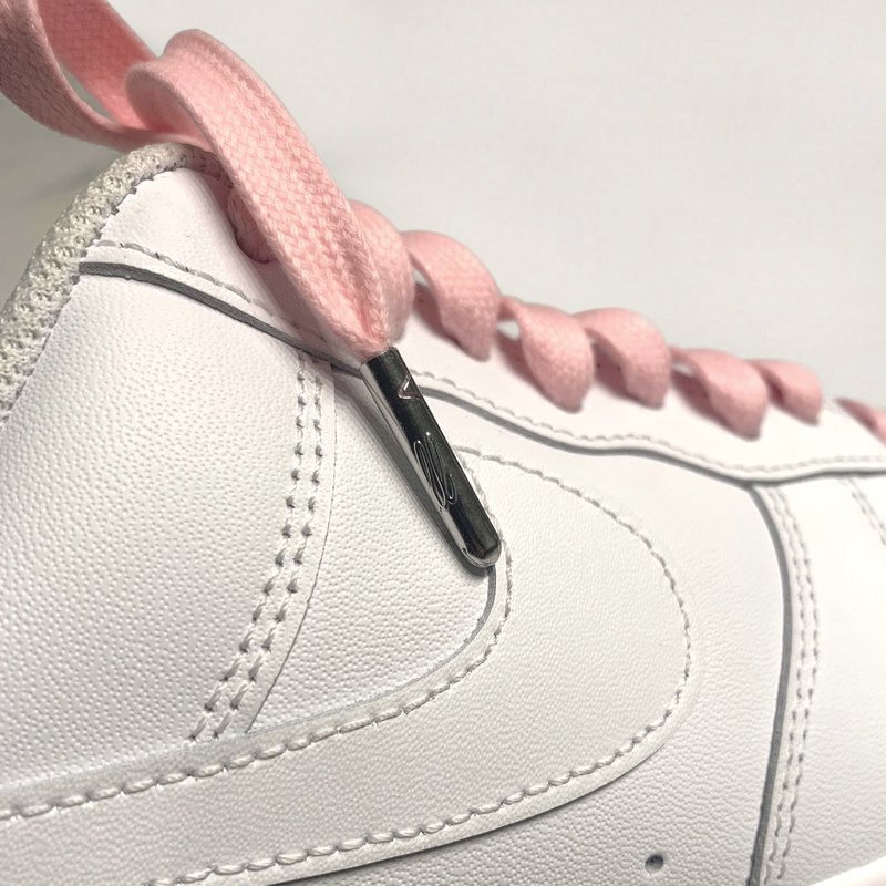 Looped Laces light pink waxed shoelaces tied in white Nike Air Force 1 with close-up on LL embossed aglet