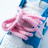 Looped Laces Light Pink Thick Rope shoelaces in Nike Dunk Low UNC sneaker close up of front