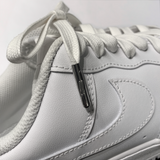 Looped Laces white waxed shoelaces tied in white Nike Air Force 1 sneaker with close-up on LL embossed aglet
